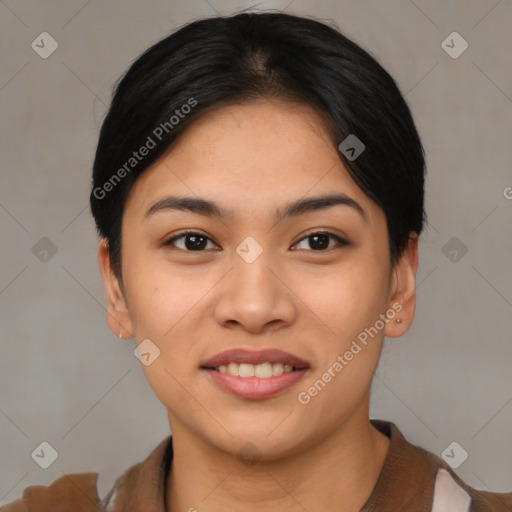 Joyful asian young-adult female with short  black hair and brown eyes