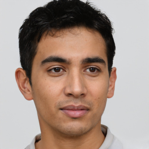 Neutral latino young-adult male with short  brown hair and brown eyes