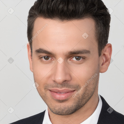 Joyful white young-adult male with short  brown hair and brown eyes