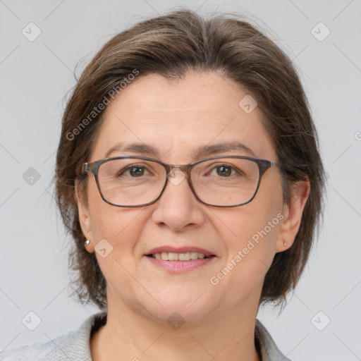 Joyful white adult female with medium  brown hair and grey eyes