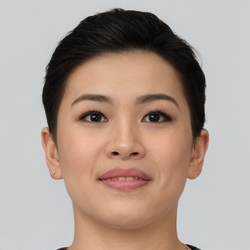 Joyful asian young-adult female with short  brown hair and brown eyes