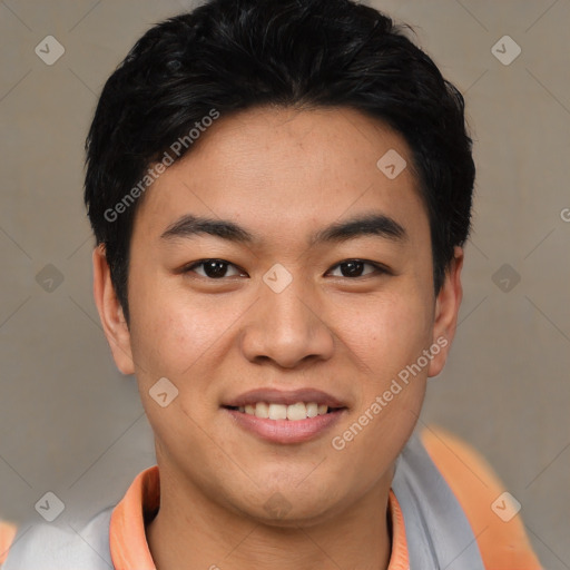 Joyful asian young-adult male with short  black hair and brown eyes