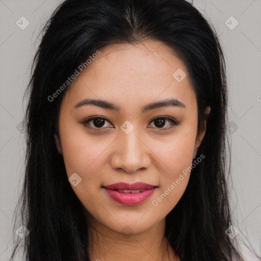 Joyful asian young-adult female with long  brown hair and brown eyes