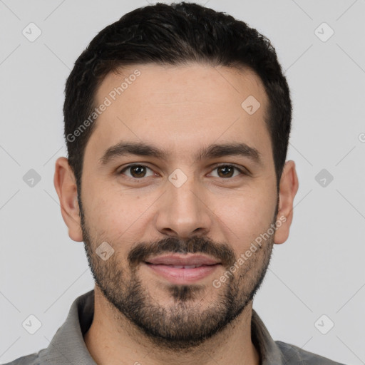 Joyful white young-adult male with short  black hair and brown eyes