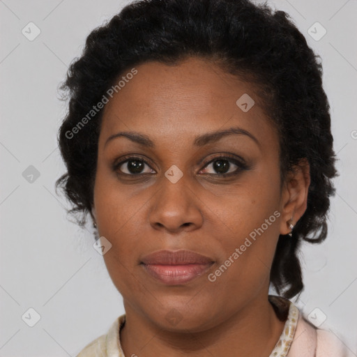 Joyful black adult female with short  brown hair and brown eyes