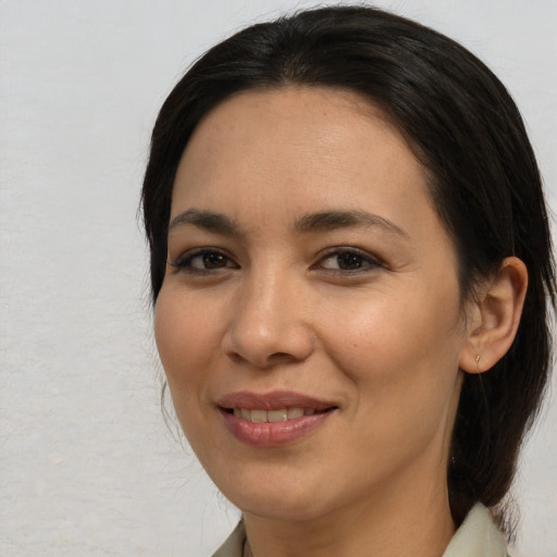 Joyful asian young-adult female with medium  black hair and brown eyes