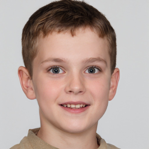 Joyful white child male with short  brown hair and grey eyes