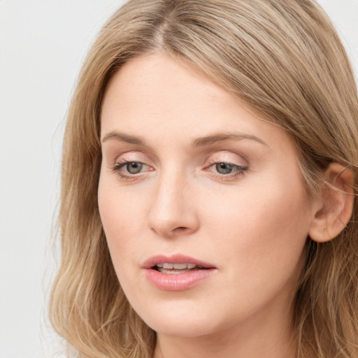 Neutral white young-adult female with long  brown hair and blue eyes