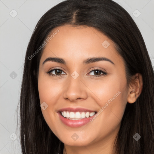 Joyful latino young-adult female with long  brown hair and brown eyes