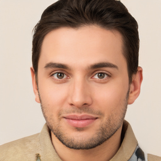 Joyful white young-adult male with short  brown hair and brown eyes