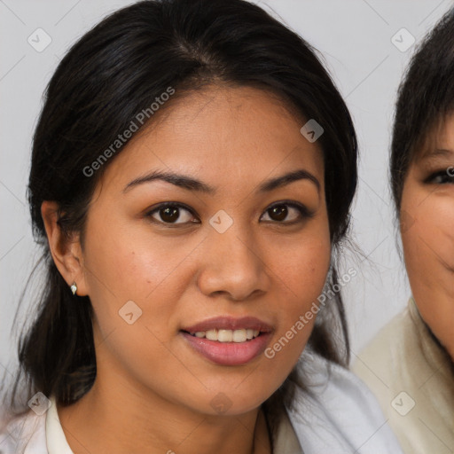 Joyful latino young-adult female with medium  brown hair and brown eyes