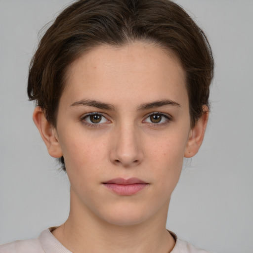 Neutral white young-adult female with short  brown hair and brown eyes