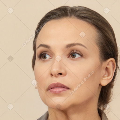 Neutral white young-adult female with medium  brown hair and brown eyes