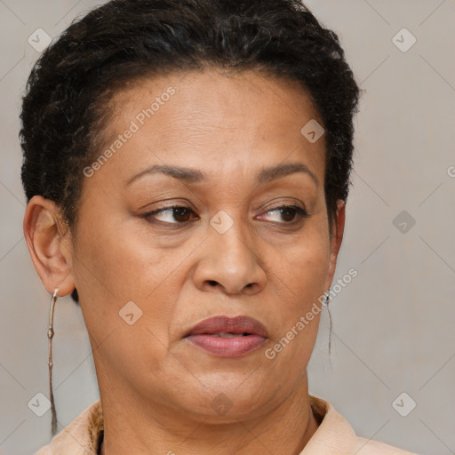 Joyful black adult female with short  brown hair and brown eyes