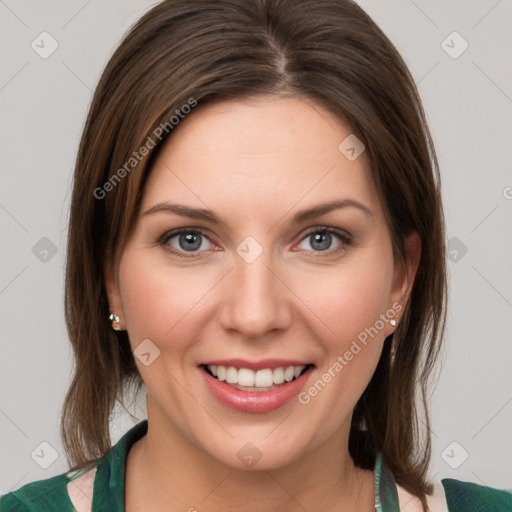 Joyful white young-adult female with medium  brown hair and green eyes