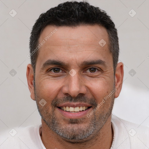 Joyful white adult male with short  brown hair and brown eyes