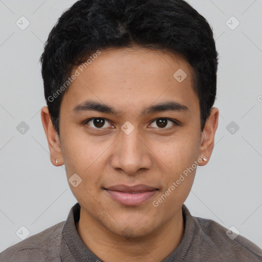 Joyful latino young-adult male with short  brown hair and brown eyes