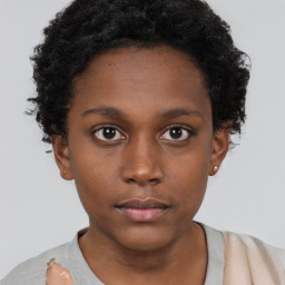 Neutral black young-adult female with short  brown hair and brown eyes