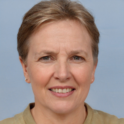 Joyful white middle-aged female with short  brown hair and grey eyes