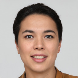 Joyful asian young-adult female with short  black hair and brown eyes