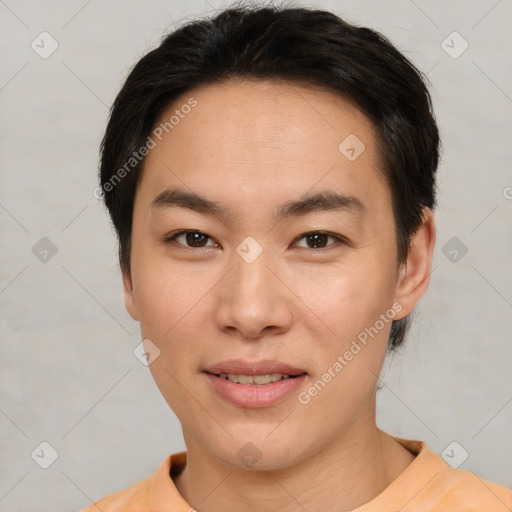 Joyful asian young-adult male with short  brown hair and brown eyes