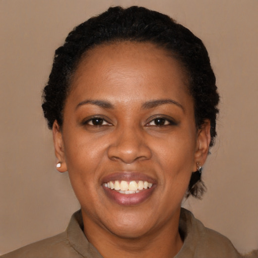 Joyful latino adult female with short  black hair and brown eyes