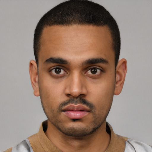 Neutral latino young-adult male with short  black hair and brown eyes