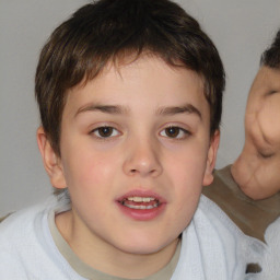 Joyful white child male with short  brown hair and brown eyes