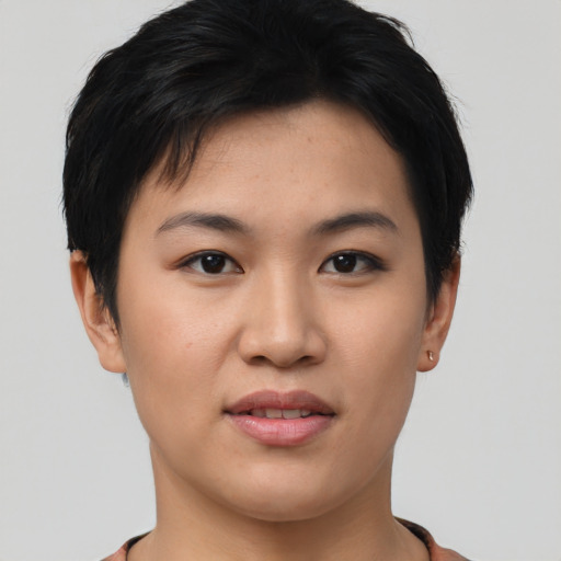 Joyful asian young-adult female with short  black hair and brown eyes