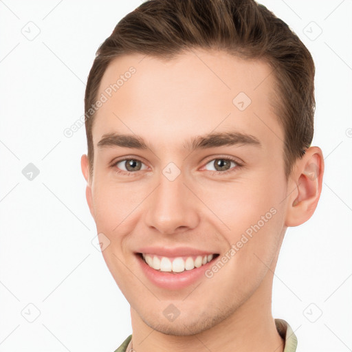 Joyful white young-adult male with short  brown hair and brown eyes