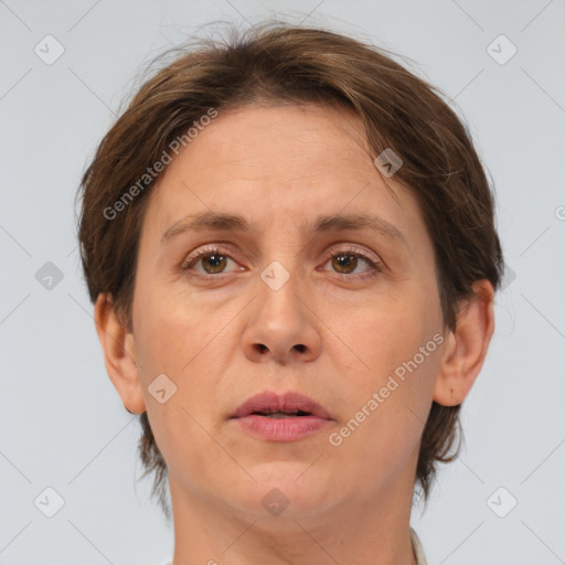 Joyful white adult female with short  brown hair and brown eyes