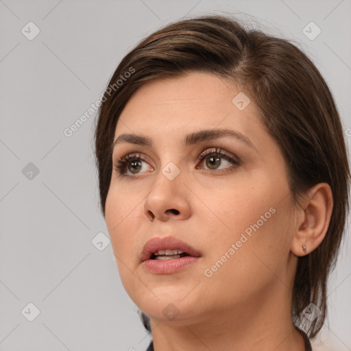 Neutral white young-adult female with medium  brown hair and brown eyes