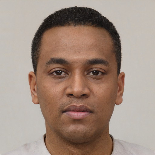 Neutral latino young-adult male with short  black hair and brown eyes