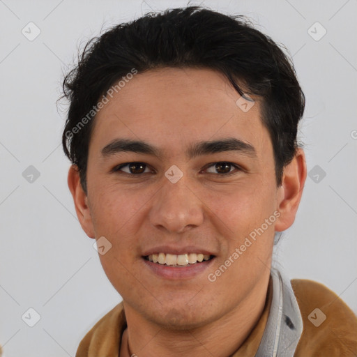 Joyful asian young-adult male with short  brown hair and brown eyes