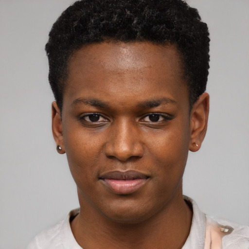 Joyful black young-adult female with short  black hair and brown eyes