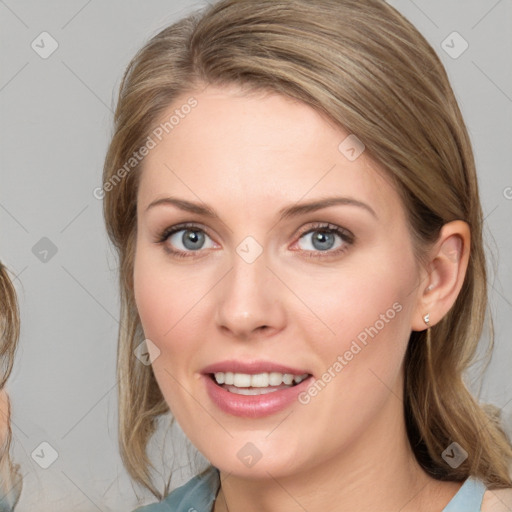 Joyful white young-adult female with medium  brown hair and blue eyes