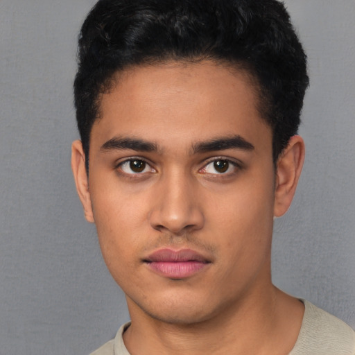 Neutral latino young-adult male with short  black hair and brown eyes