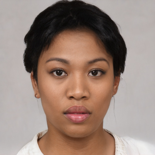 Neutral latino young-adult female with short  black hair and brown eyes