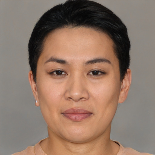 Joyful asian young-adult female with short  black hair and brown eyes