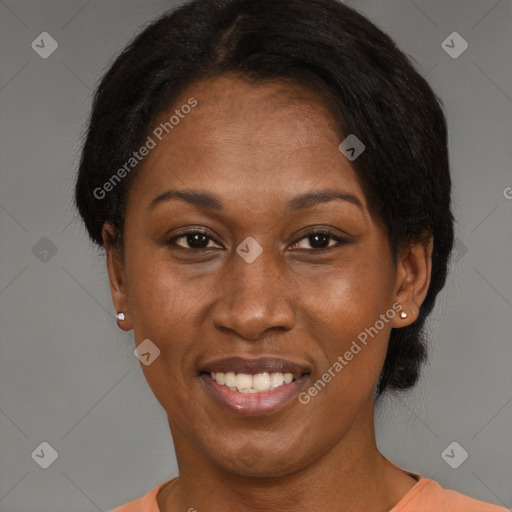 Joyful black adult female with short  brown hair and brown eyes