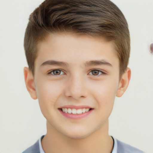 Joyful white child male with short  brown hair and brown eyes