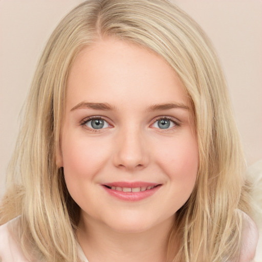 Joyful white young-adult female with long  brown hair and blue eyes