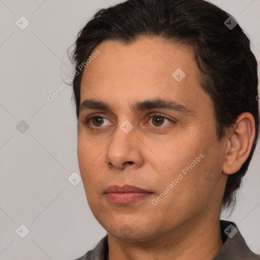 Joyful white adult male with medium  brown hair and brown eyes