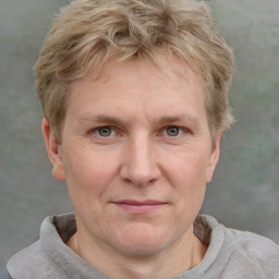 Joyful white adult male with short  brown hair and grey eyes