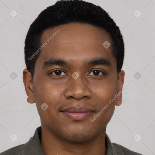 Joyful black young-adult male with short  black hair and brown eyes