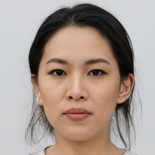 Neutral asian young-adult female with medium  brown hair and brown eyes