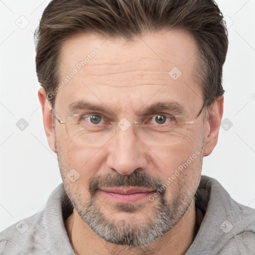 Joyful white adult male with short  brown hair and grey eyes