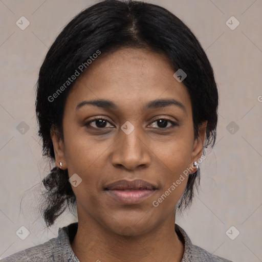 Joyful black young-adult female with medium  black hair and brown eyes