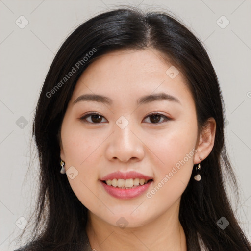 Joyful asian young-adult female with long  brown hair and brown eyes