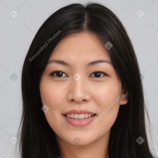 Joyful asian young-adult female with long  brown hair and brown eyes